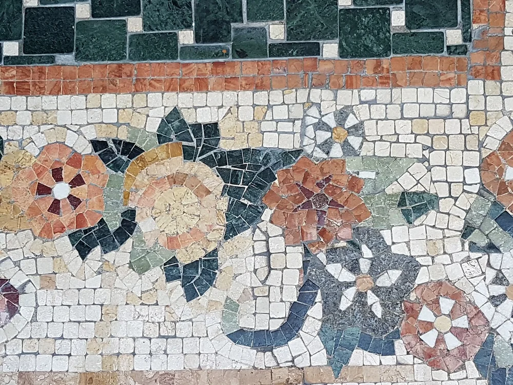 Conservatory glass rotunda illuminated with thousands of seasonal blossoms
