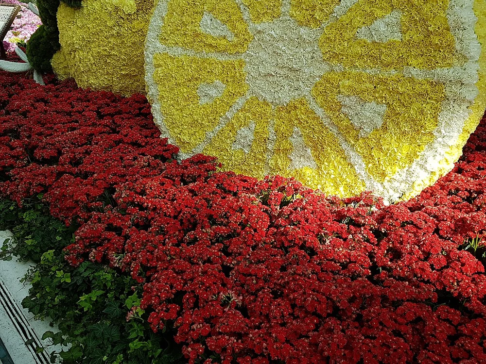 Center botanical pavilion featuring kinetic floral animals and waterfalls