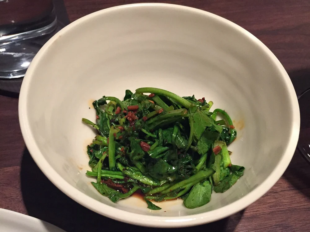 Famous steamed pork belly buns with hoisin and scallion ribbons