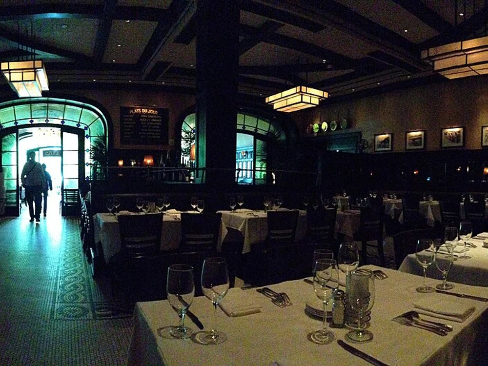 Historic bistro host podium with bread station and wine displays