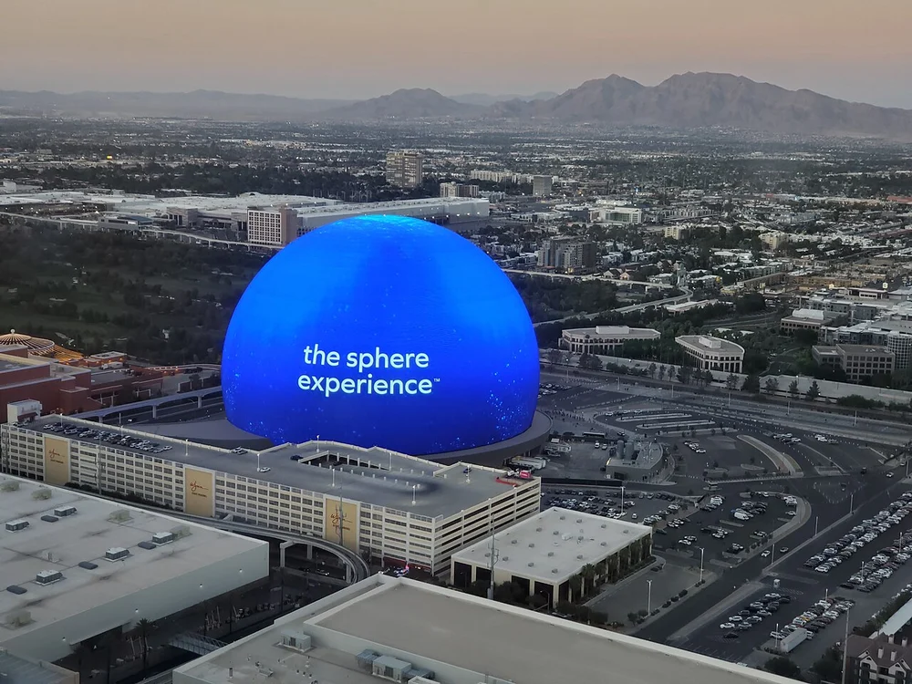 Illuminated 580,000 sq ft Exosphere glowing across the Las Vegas skyline